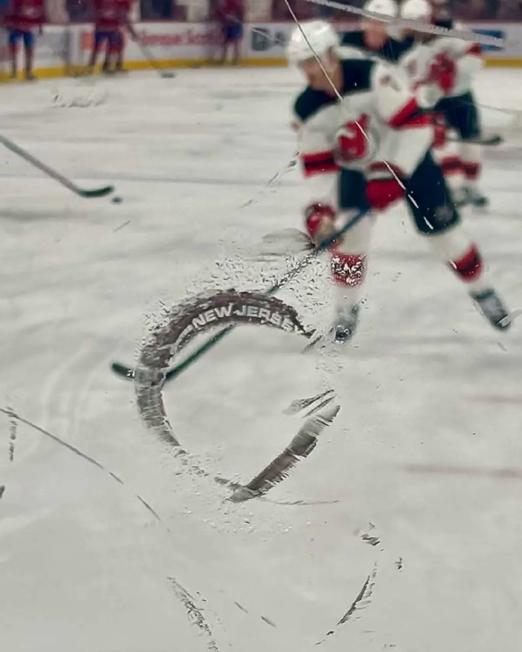 A hockey puck hit the glass…