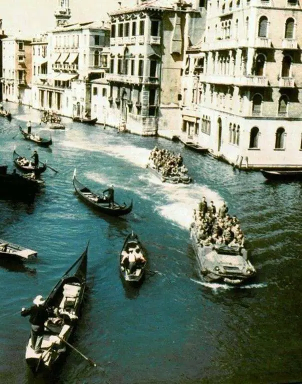 American DUKW-353 amphibians navigate the…